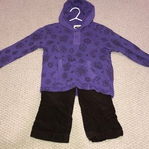 Purple pullover  and brown corduroy pants